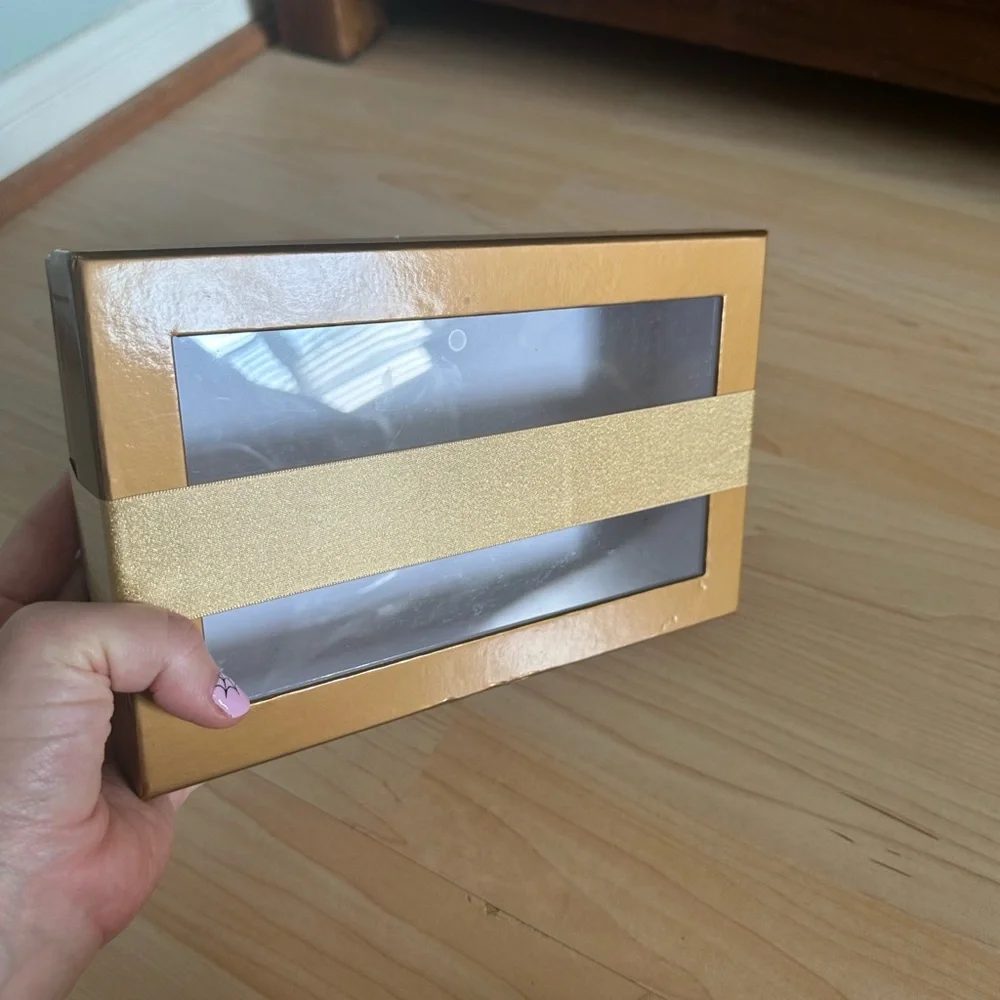 Gold clear lid gift box with banded gold ribbon